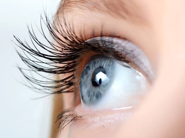 Close-up of a woman’s blue eye.